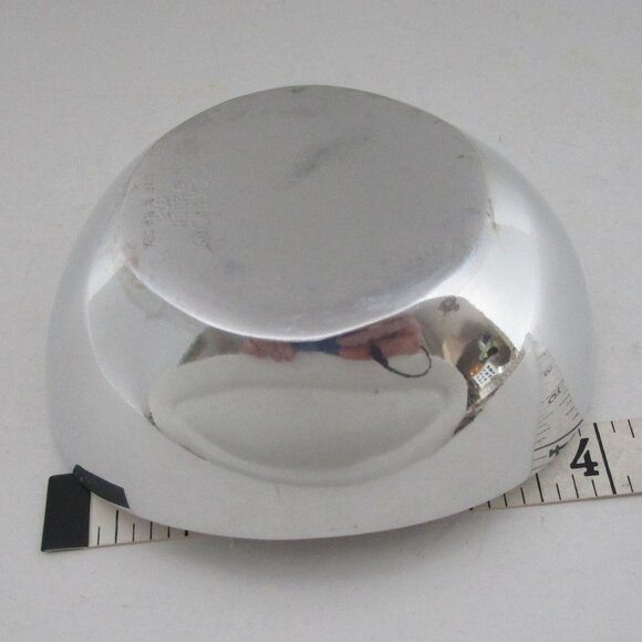 polished aluminum candle holder